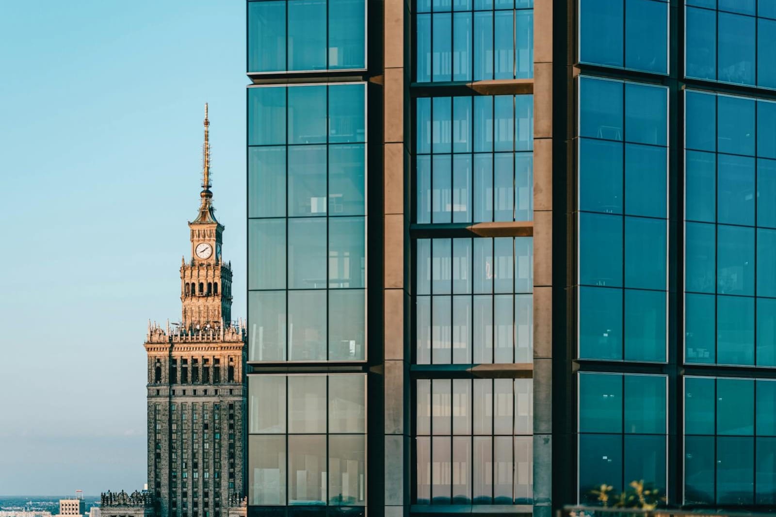 A juxtaposition of modern skyscrapers and the Palace of Culture and Science in Warsaw, Poland.