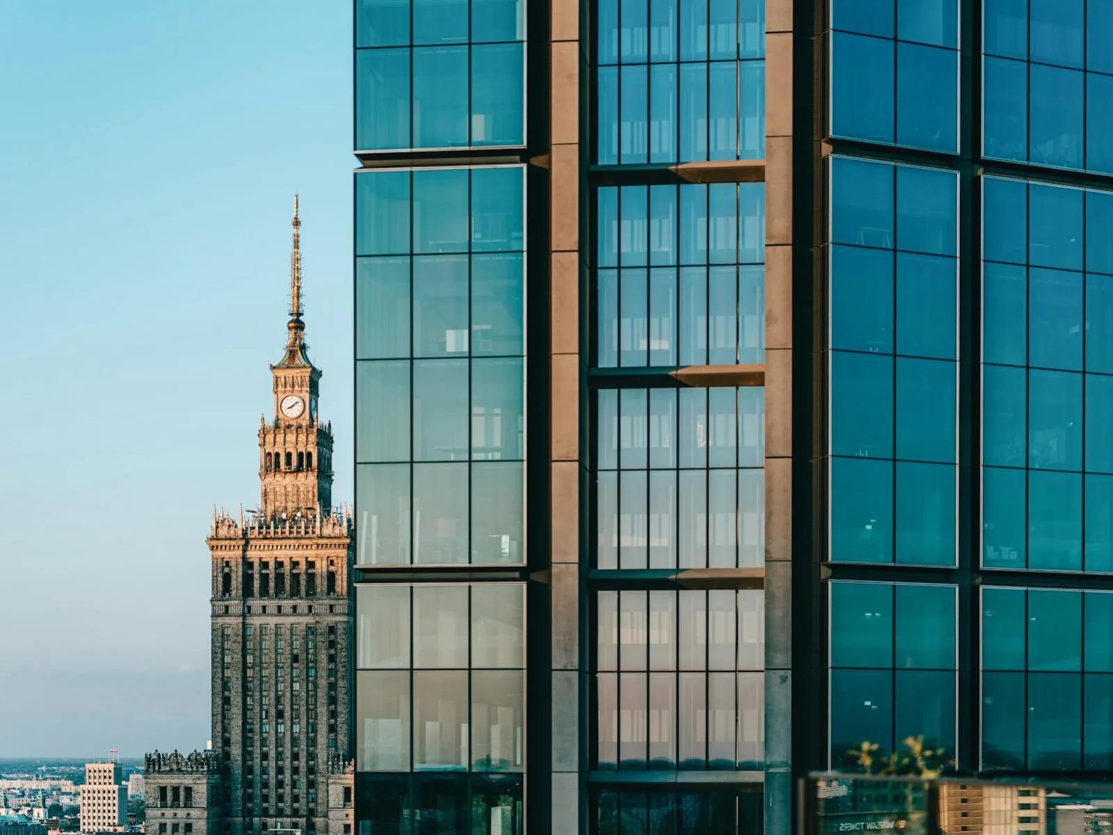 A juxtaposition of modern skyscrapers and the Palace of Culture and Science in Warsaw, Poland.