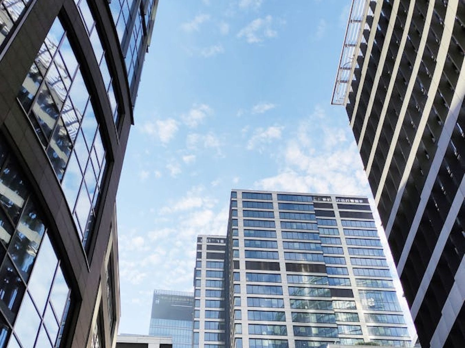 A stunning view of modern skyscrapers against a clear blue sky in Warsaw, Poland.
