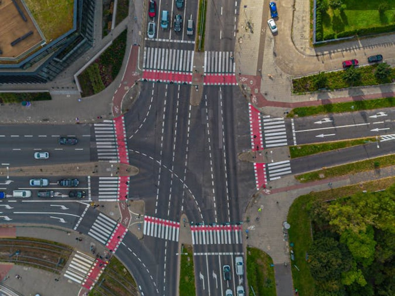 Aerial view of a busy urban intersection in Kraków, Poland, showcasing traffic dynamics.