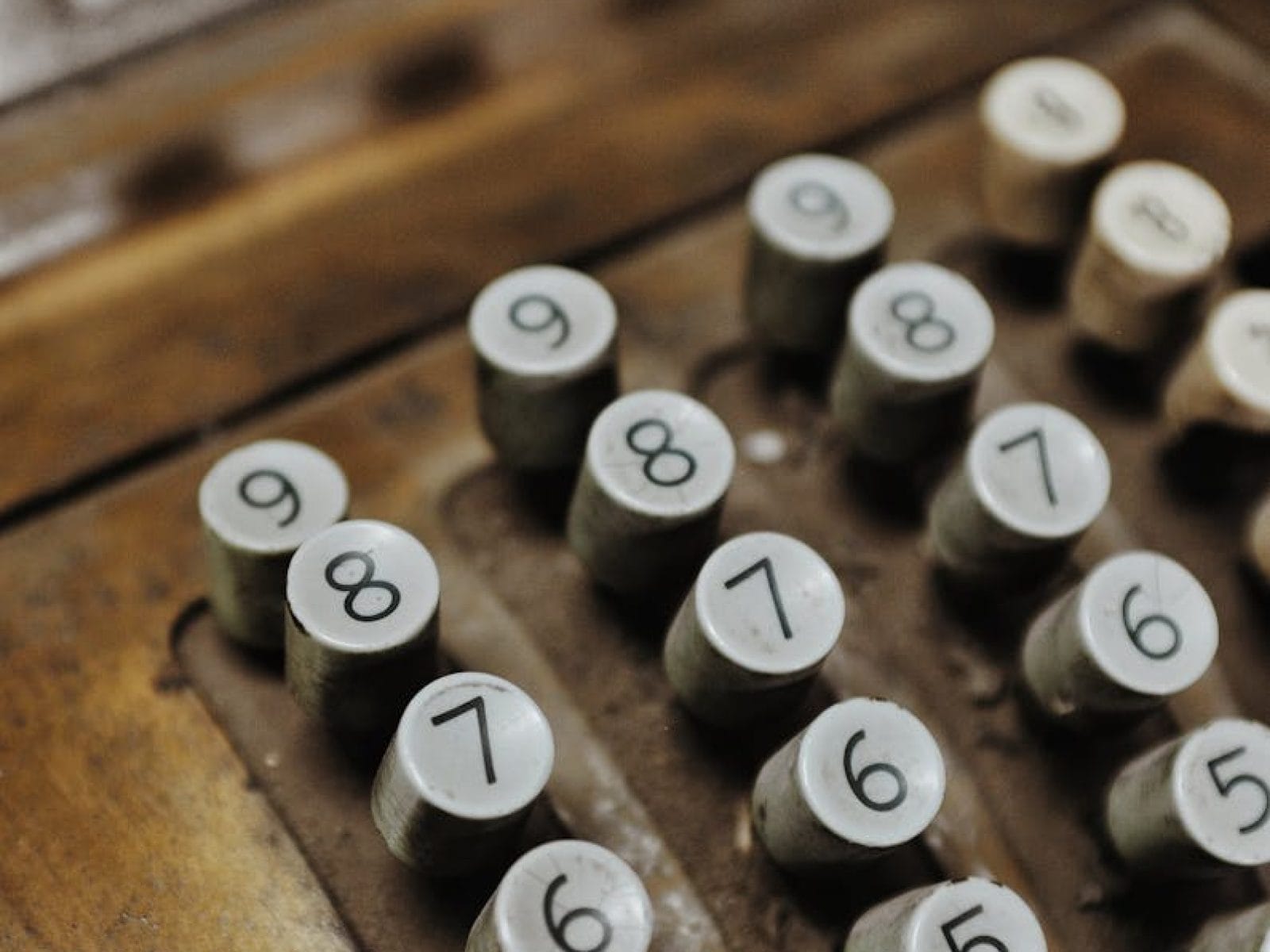 Close-up of a vintage cash register showcasing its antique keys, set in Chile.
